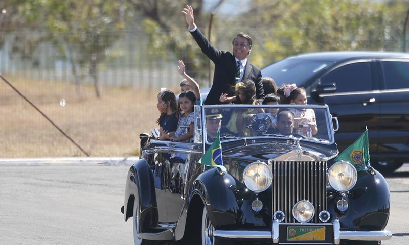 Brazilian President Jair Bolsonaro waves to people during the celebration for the 198th anniversary of the country's Independence Day in Brasilia, Brazil, Sept. 7, 2020. (Photo by Lucio Tavora/Xinhua)