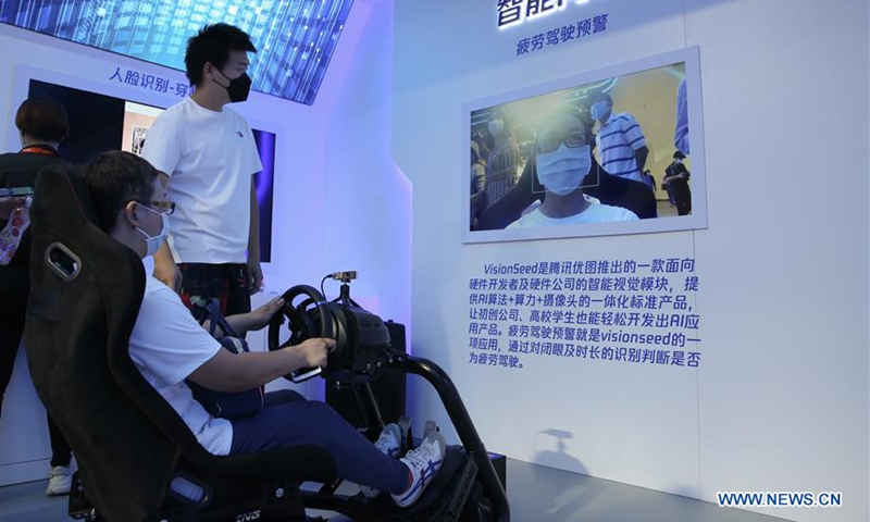 People experience VisionSeed system at the booth of Tencent at the comprehensive exhibition area of the 2020 China International Fair for Trade in Services (CIFTIS) in Beijing, capital of China, Sept. 8, 2020. Chinese enterprises demonstrated latest innovations and technologies such as 5G and AI at the fair. (Xinhua/Pan Siwei)
