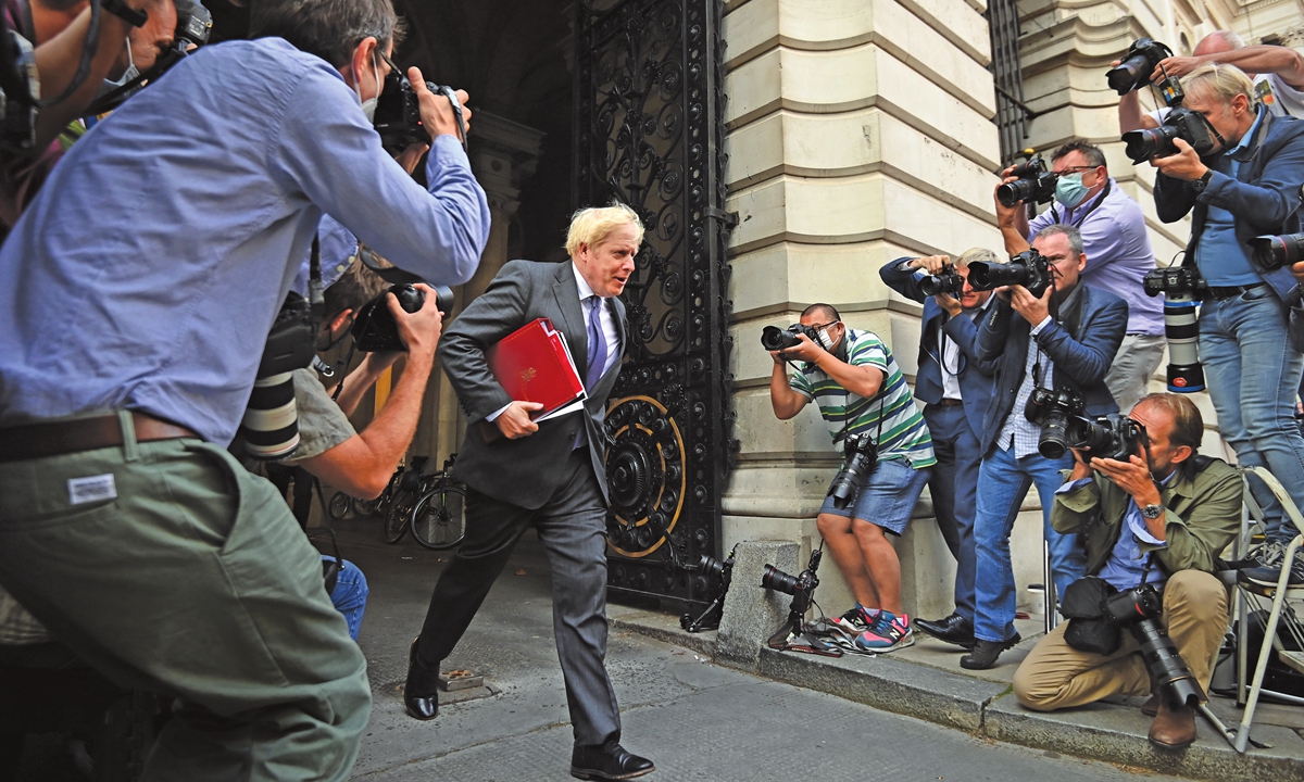 British Prime Minister Boris Johnson returns to Downing Street following a cabinet meeting at the Foreign and Commonwealth office on Tuesday. Downing Street has warned peers not to try to block controversial legislation overriding key elements of the Brexit Withdrawal Agreement. (See story on Page 16) Photo: AFP