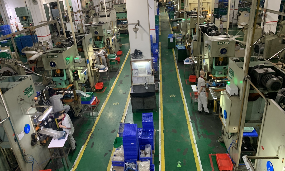 A Taiwan factory that makes electronic components and iron-made hardware parts for various devices are equipped with automatic machines to increase production output. Photo: Chen Qingqing/GT