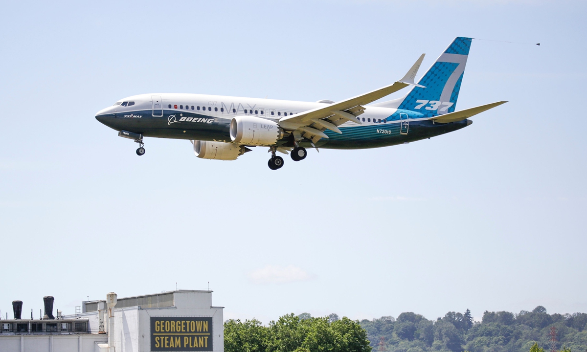 A Boeing 737 MAX jet lands following Federal Aviation Administration (FAA) test flight at Boeing Field in Seattle, Washington on June 29. Photo: VCG