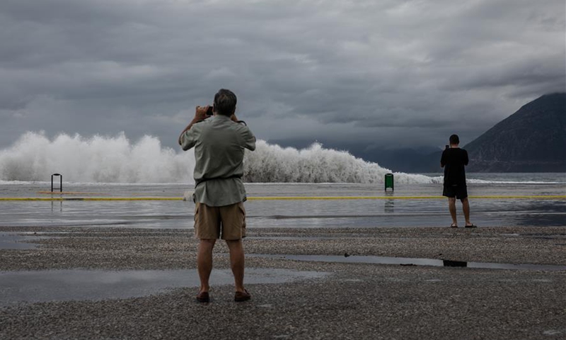 Storm-triggered waves approach town of Rio in suburbs of Patras, Greece ...
