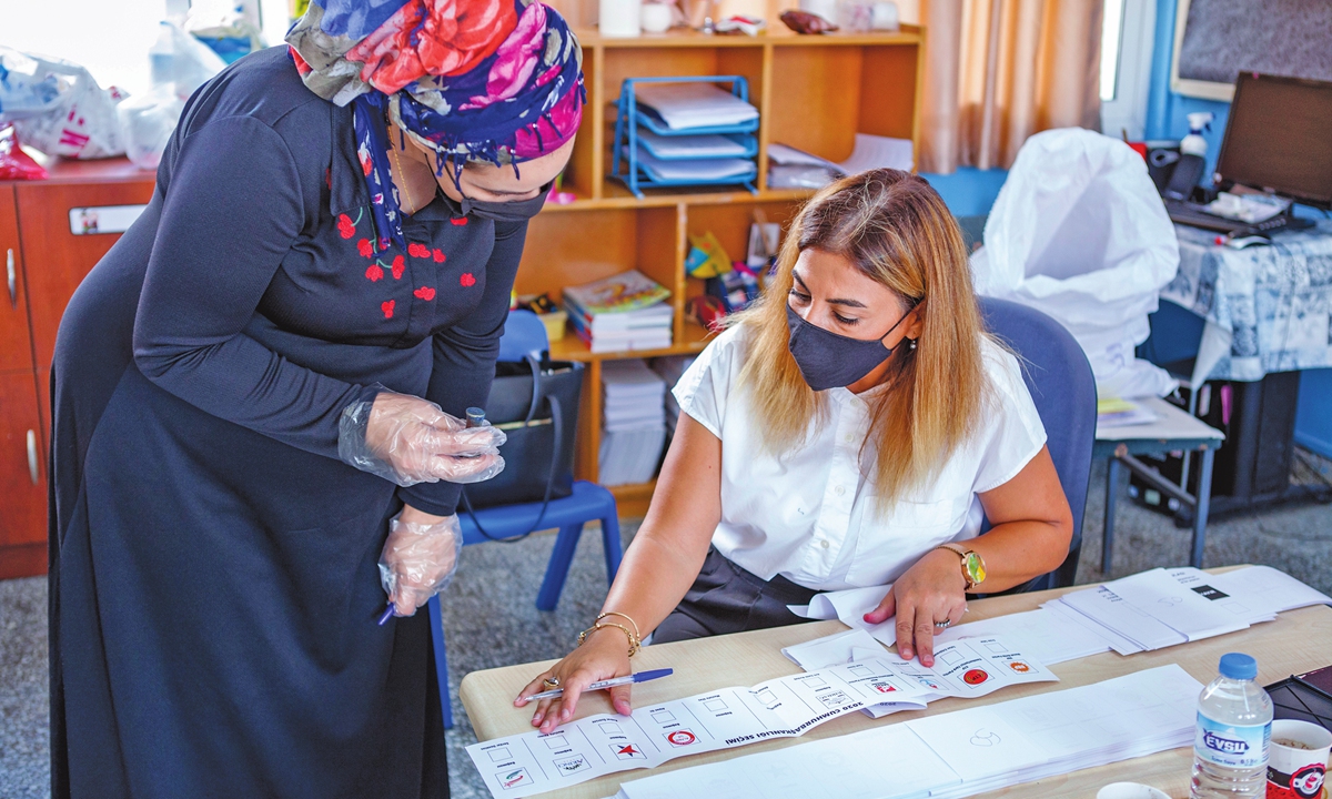 A woman prepares to vote at a polling station in the northern part of Nicosia, Cyprus, during the presidential election on Sunday. The self-proclaimed Turkish Republic of Northern Cyprus (TRNC) started a vote for a new leader amid heightened tensions on the divided island and in the wider eastern Mediterranean region. Photo: AFP
