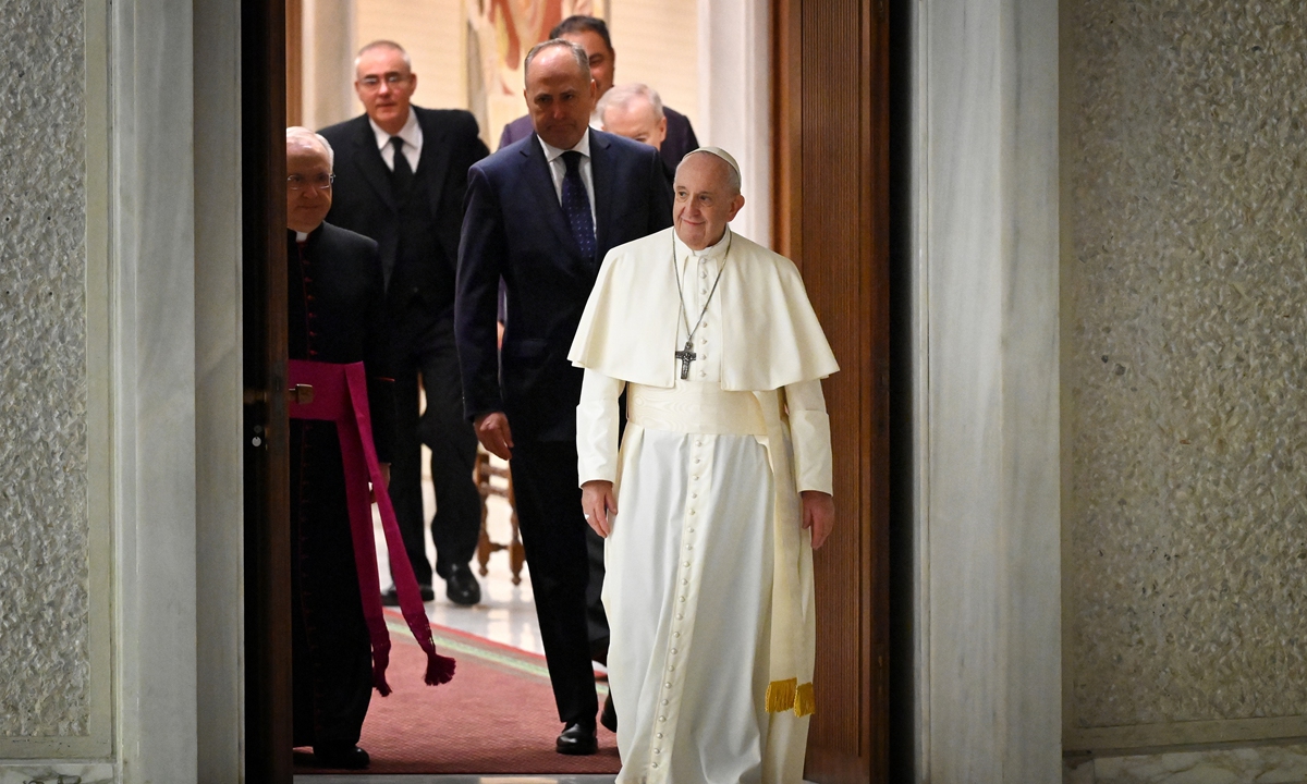 Pope Francis arrives to lead his weekly general audience in the Paul VI hall at the Vatican on Wednesday. Wednesday Papal Audiences usually take place in Saint Peter's Square at 10 or 10:30 am and last about 90 minutes. Photo: AFP