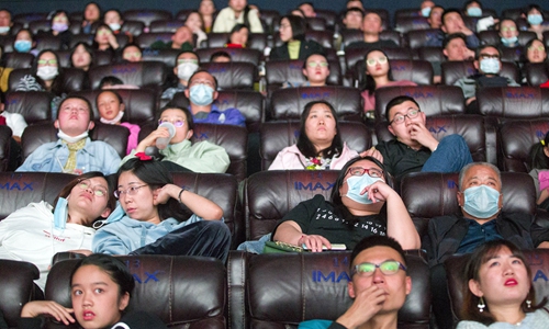 Movie-goers enjoy themselves at a cinema in Taiyuan, North China's Shanxi Province. The Chinese mainland box office totaled 3.69 billion yuan ($544.33 million) during the first seven days of the National Day holiday period, the second highest grossing amount in history for the same period, data showed. Photo: cnsphoto