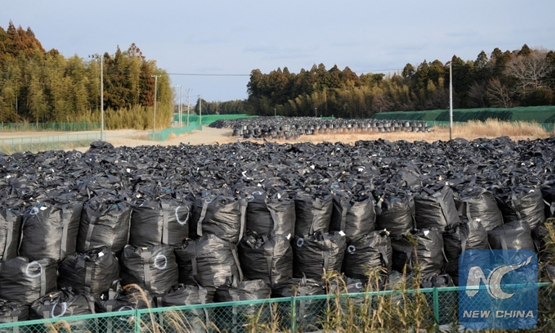 This photo shows black bags of contaminated earth piling up at a collection site at Tokyo Electric Power Co's Fukushima Daiichi nuclear power plant in Okuma, Fukushima, Japan, February 23, 2017. Photo: Xinhua