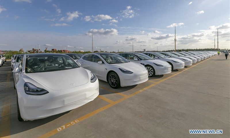 Photo taken on Oct. 19, 2020 shows the Tesla China-made Model 3 vehicles which will be exported to Europe at Waigaoqiao port in Shanghai, east China, Oct. 19, 2020. U.S. carmaker Tesla announced on Monday that it would export the made-in-China Model 3 to Europe, marking another important milestone for its Shanghai Gigafactory. The first batch of exported sedans will leave Shanghai next Tuesday and arrive at the port of Zeebrugge in Belgium at the end of November before being sold in European countries, including Germany, France, Italy, Spain, Portugal, and Switzerland. (Xinhua/Wang Xiang)