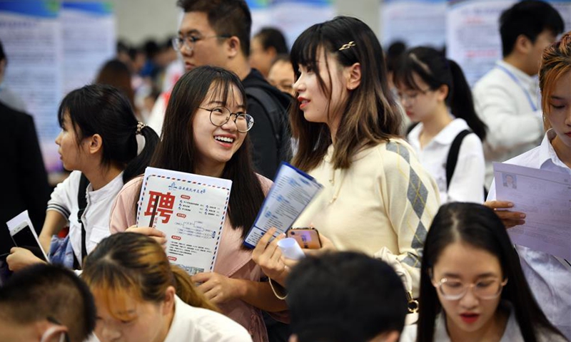 Job seekers attend a job fair in Haikou, south China's Hainan Province, Oct. 25, 2020. A job fair, which provided nearly 8,000 job vacancies, was held here on Sunday and attracted thousands of graduates. (Xinhua/Guo Cheng)