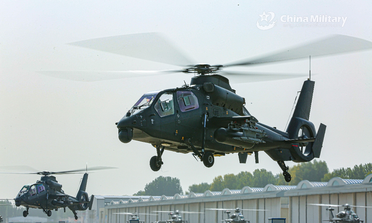 Two Z-19 attack helicopters attached to an army aviation brigade under the PLA 80th Group Army lift off from the parking apron during a round-the-clock flight training mission on October 21, 2020. (eng.chinamil.com.cn/Photo by Yi Diyu)