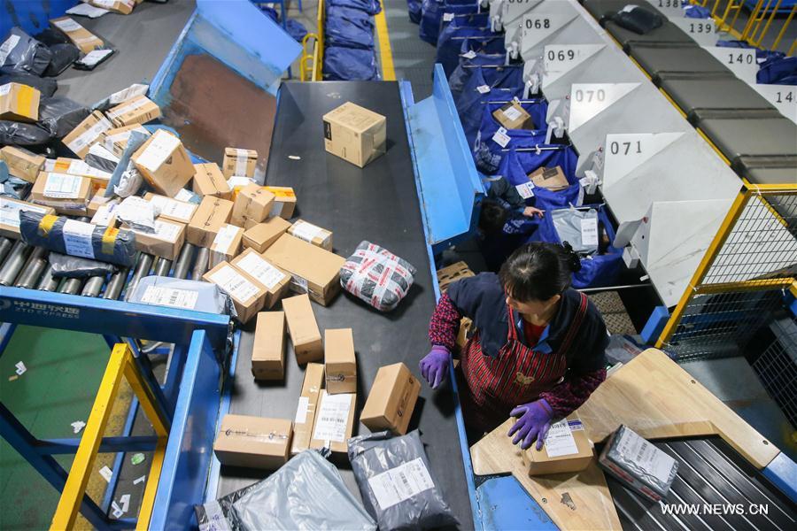 An employee works at the Shanghai distribution center of ZTO Express in Shanghai, east China, Nov. 12, 2017. Courier companies were running at full speed to deliver massive number of parcels after Alibaba Group's 11.11 Singles' Day global online shopping spree on Nov. 11. (Xinhua/Ding Ting)