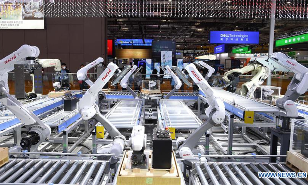 Photo taken on Nov. 5, 2020 shows the industrial robots of Nachi company from Japan at the Equipment exhibition area during the third China International Import Expo (CIIE) in Shanghai, east China. (Xinhua/Li Renzi)