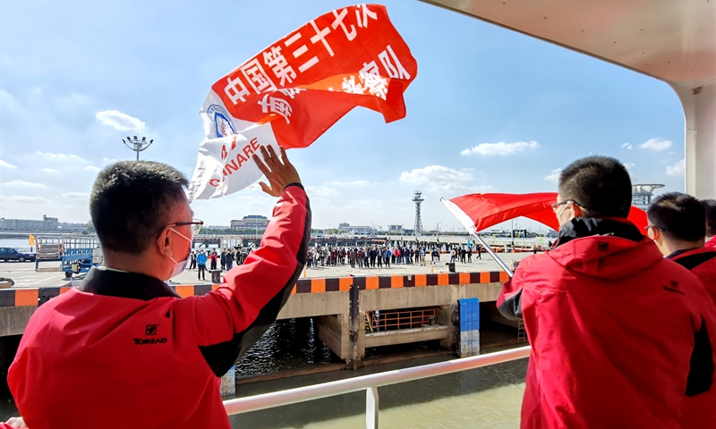 China launches its 37th scientific expedition to Antarctica on Tuesday in Shanghai. Members of the Antarctic scientific research team bid farewell on the Xuelong 2 research vessel to those seeing them off. Photo: Xinhua 