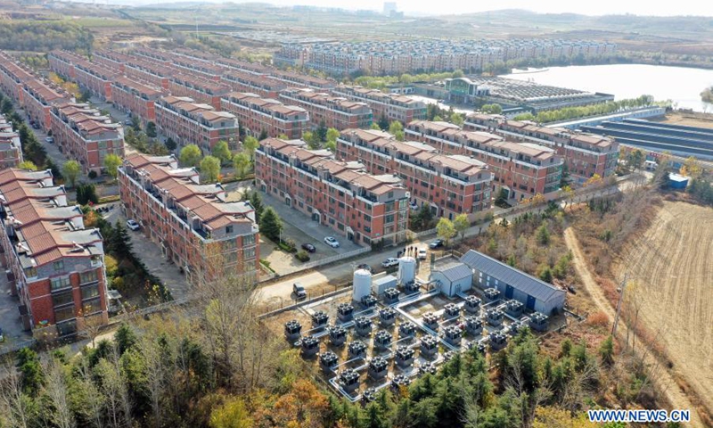 Aerial photo taken on Nov. 12, 2020 shows a heating station with clean energy at Wendeng district in Weihai, east China's Shandong Province. Shandong launched a campaign to promote a shift from coal to electricity for 358,400 households during its heating season in 2020, which will save 270,000 tonnes of standard coal and reduce emission of 680,000 tonnes of carbon dioxide in the heating season. (Xinhua/Zhu Zheng)