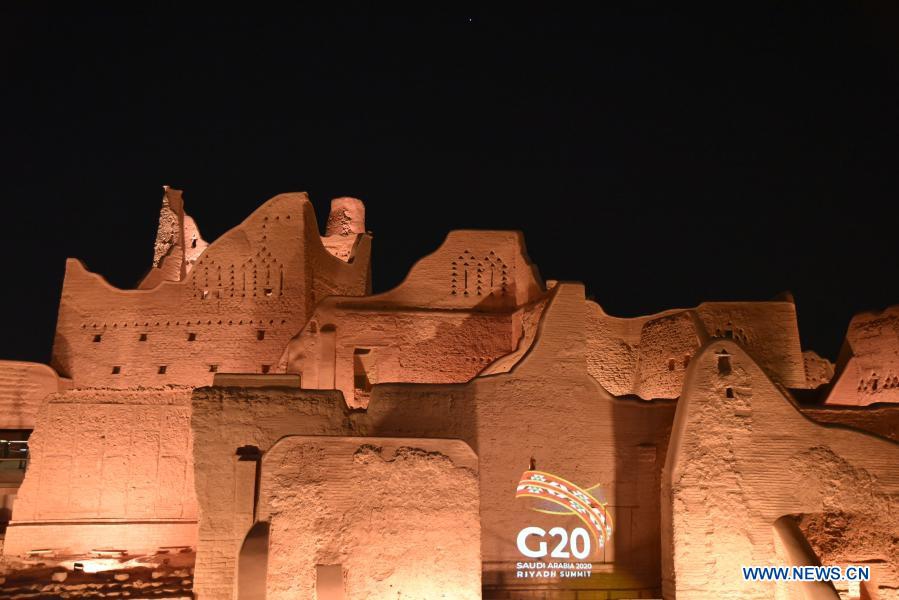 Photo taken on Nov. 20, 2020 shows the logo of Group of Twenty (G20) being projected at a historic site in Diriyah, on the outskirts of Riyadh, Saudi Arabia. The 2020 G20 Summit will be held virtually on Nov. 21 - 22, chaired by Saudi King Salman bin Abdulaziz Al Saud. (Xinhua/Tu Yifan)