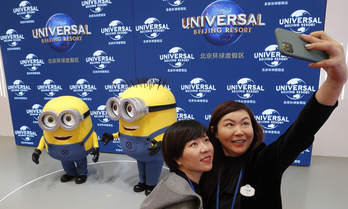 Visitors take selfies at the booth of Universal Studios Beijing at the China International Travel Mart 2020 in Shanghai on Monday. Sponsored by the Chinese Ministry of Culture and Tourism, Civil Aviation Administration of China and Shanghai Municipal People’s Government, the mart is meant to improve the dual-circulation development model amid the coronavirus pandemic. Photo: cnsphoto