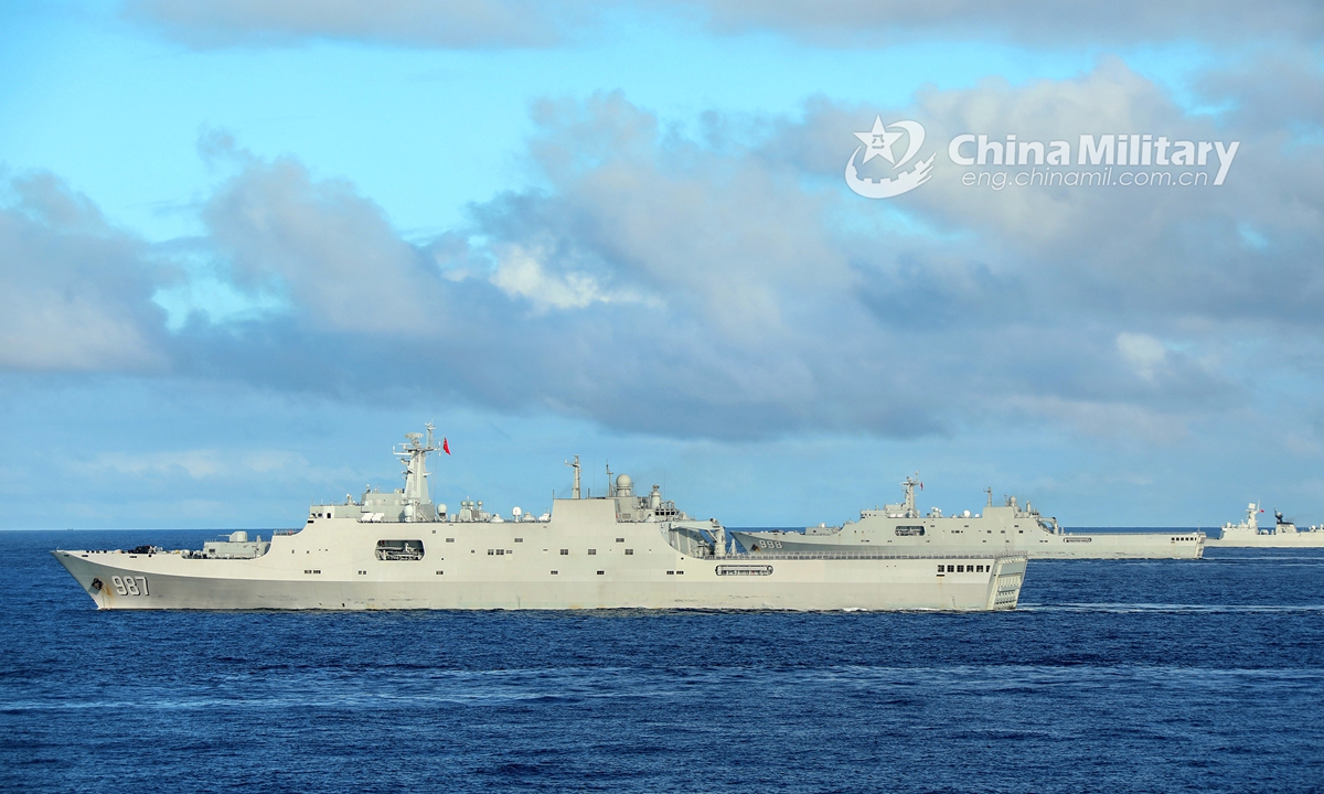 The amphibious dock landing ships <em>Wuzhishan</em> (Hull 987), Kunlunshan (Hull 998) and Changbaishan (Hull 989) attached to a landing ship flotilla with the navy under the PLA Southern Theater Command steam alongside in waters of the South China Sea during a maritime training exercise on November 18, 2020. The exercise lasted four days, focusing on 10 subjects including comprehensive defense, Landing Craft Air Cushion's (LCAC) transfer, visit, board, search and seizure (VBSS) operation, and live-fire operations. (eng.chinamil.com.cn/Photo by Liu Jian)
