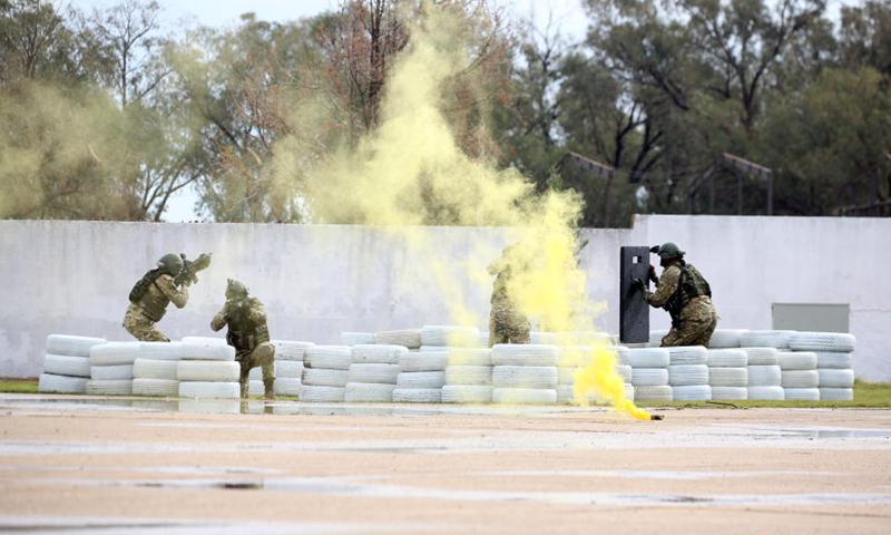 The special military forces of Libya's UN-backed government perform the military skills on the graduation day in Omar Al-Mokhtar training center, near Tripoli, Libya, on Nov. 21, 2020. Libya's UN-backed government on Saturday announced that the first group of special military forces trained by Turkey has graduated. (Photo by Hamza Turkia/Xinhua)