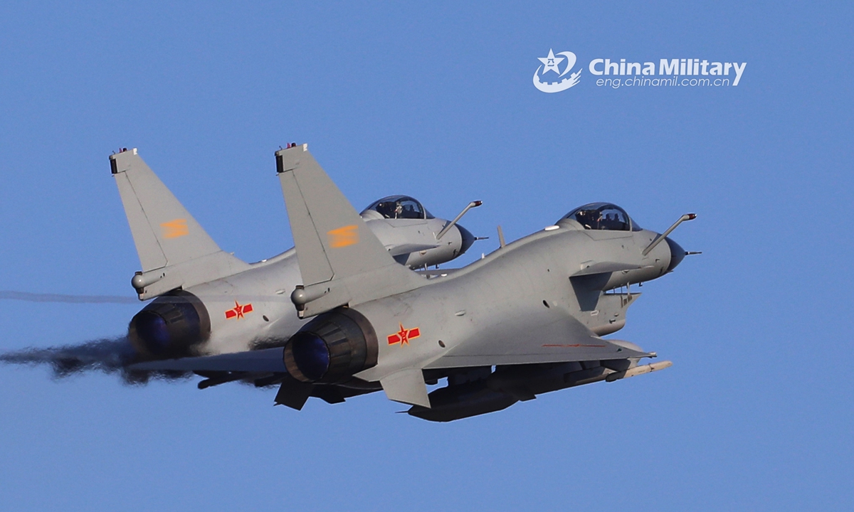 Two J-10 fighter jets attached to an aviation brigade of the air force under the PLA Southern Theater Command soar into the air in formation during a combat flight training mission on November 17, 2020. (eng.chinamil.com.cn/Photo by Wu Gaoming)
