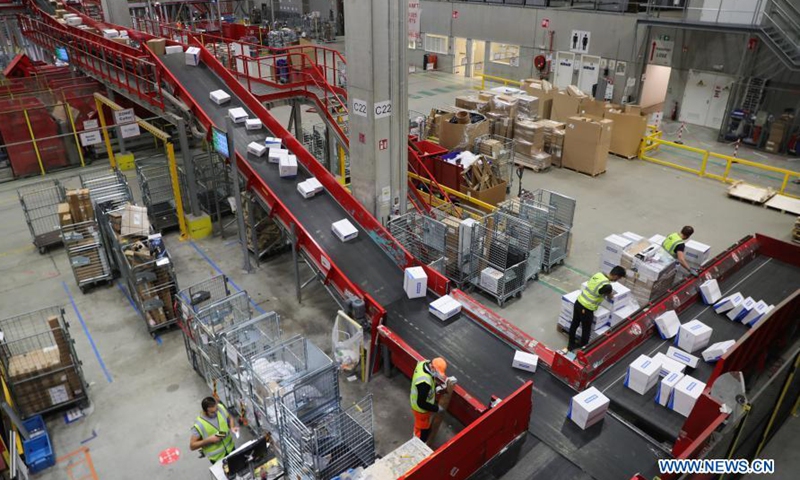 Parcels are sorted on the belts at a sorting center of Bpost, the Belgian postal service, in Brussels, Belgium, Nov. 26, 2020. Belgium is currently under strict lockdown measures against the COVID-19 pandemic, as all non-essential businesses are closed. As the Black Friday and Christmas season approaches, Bpost faces increasing amount of parcels due to the rising demand of e-commerce.Photo:Xinhua