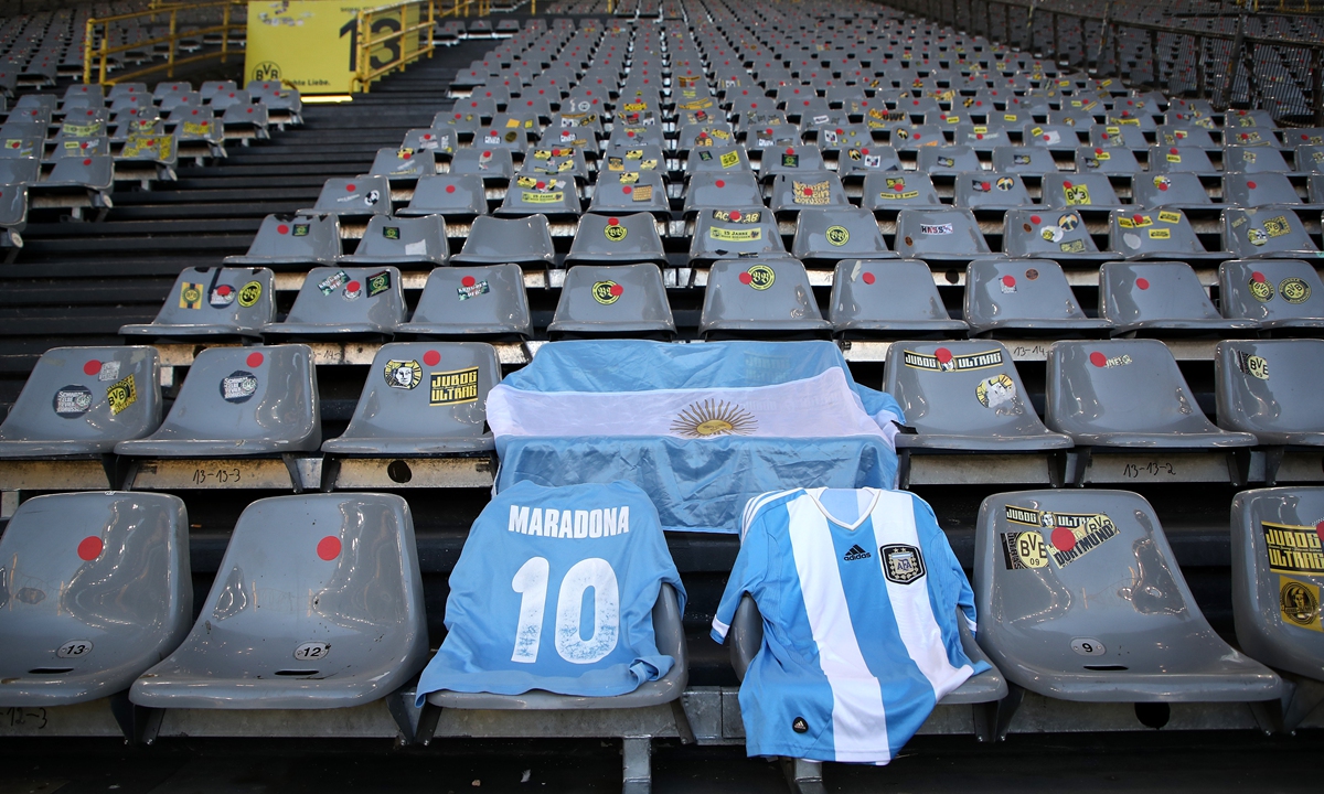 An Argentina flag and shirts are laid out in the stands in memory of Diego Maradona prior to the match between Borussia Dortmund and FC Koln on Saturday in Dortmund, Germany. Photo: VCG