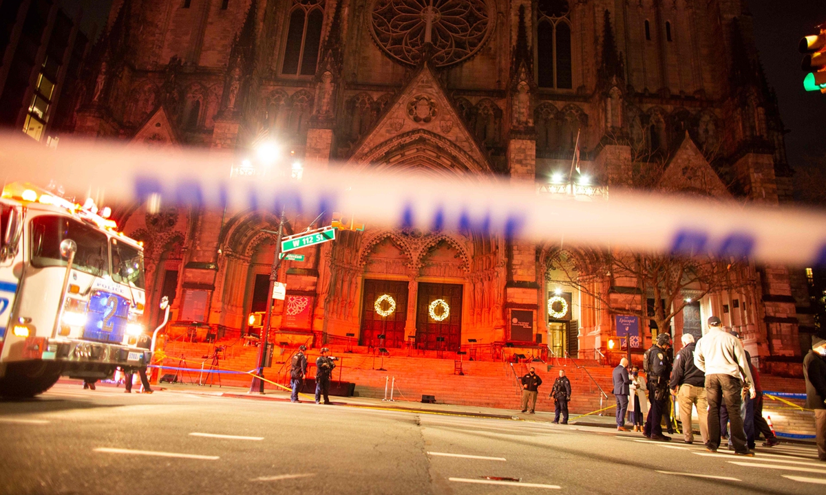 New York gunman shot dead after opening fire outside cathedral Christmas concert on Sunday. Photo: VCG