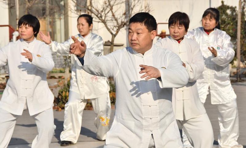 Taijiquan enthusiasts practise Taijiquan at a traditional martial art school in Yongnian District, Handan City of north China's Hebei Province, Dec. 16, 2020. The United Nations Educational, Scientific and Cultural Organization (UNESCO) inscribed on Thursday China's Taijiquan on the Representative List of the Intangible Cultural Heritage of Humanity. Taijiquan, a kind of traditional martial arts, was born in the mid-17th century in a small village named Chenjiagou located in Central China's Henan province, before it spread to more than 150 countries and regions, attracting more than 100 million people to practise.Photo:Xinhua