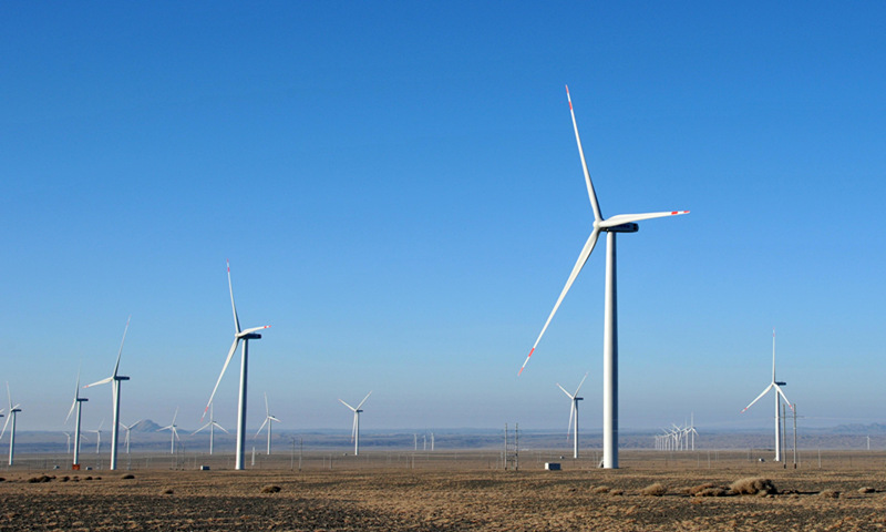 Wind turbines run smoothly in Qitai county in Northwest China's Xinjiang Uygur Autonomous Region. Bordering Mongolia and located east of the Altay Mountains, the county is known as the hometown of wind for its strong year-round gusts that sometimes annoy residents. With investment by wind power enterprises, the county has become a new energy base with an annual capacity of 1.7 million kilowatts. Photo: cnsphoto 