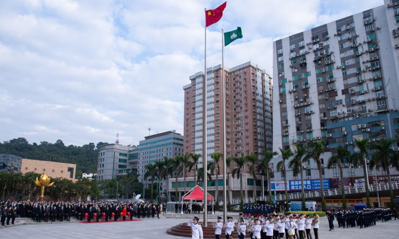 A flag-raising ceremony marking the 21st anniversary of Macao's return to the motherland is held at the Golden Lotus Square in Macao, south China, Dec. 20, 2020. (Xinhua/Cheong Kam Ka)
