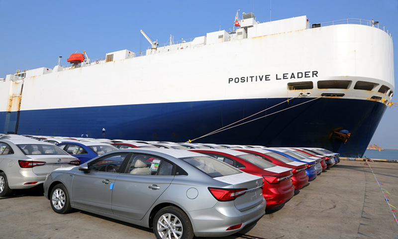 A ship berths at the Lianyungang Port in East China's Jiangsu Province on Tuesday, waiting to load 1,300 cars for export. This year, the port has added sea routes to Southeast Asia and South Korea, and rail and water links to domestic ports. From January to November, Lianyungang port handled a record 568,900 TEUs, up 62.8 percent year-on-year, and it is expected to handle over 600,000 TEUs this year. Photo: VCG