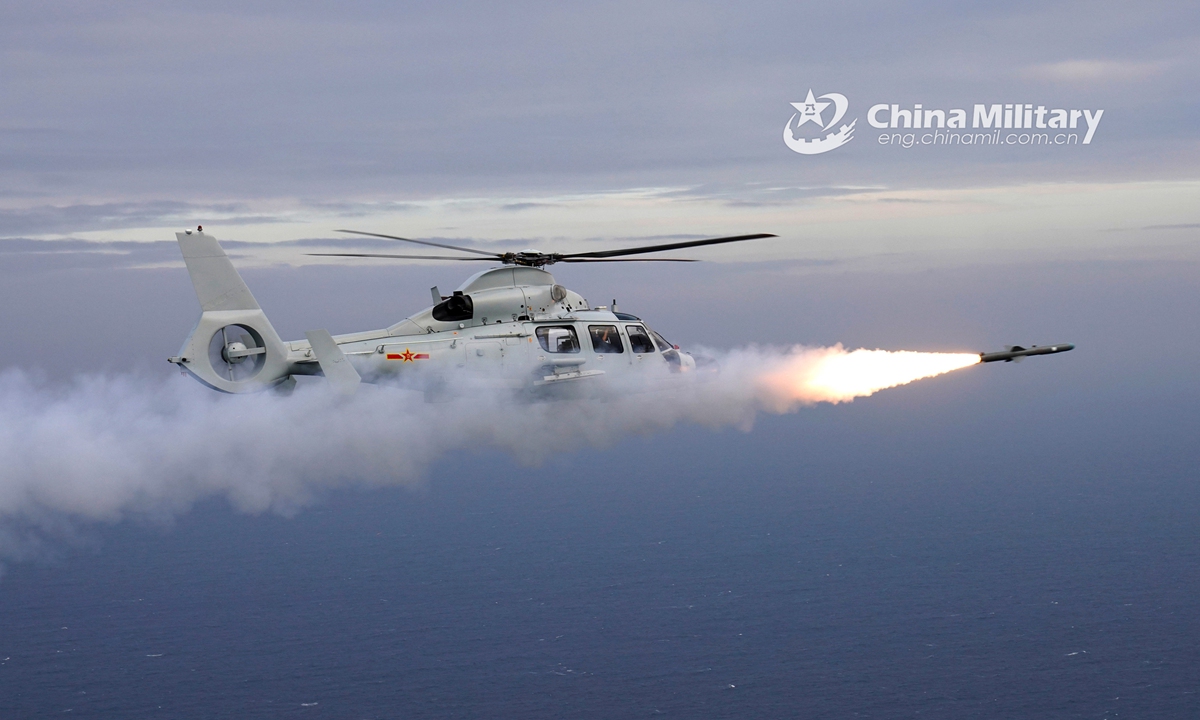 Ship-borne helicopters fire missiles - Global Times