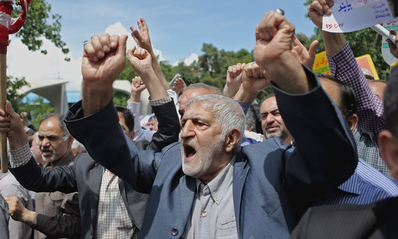 People chant slogans in a protest to condemn U.S. withdrawal from the 2015 Iran nuclear deal in Tehran, Iran, on May 11, 2018. (Xinhua/Ahmad Halabisaz)