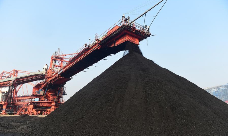 Photo taken on Dec. 22, 2020 shows a thermal coal yard of Huanghua Port in Cangzhou City, north China's Hebei Province. Huanghua Port, one of the key ports for thermal coal transportation in China, has stepped up its turnover rate since this December. A daily average of 500,000 tonnes of thermal coal is loaded to ships at the port now to quench the thirst for coal-fired power generation in southern parts of the country. (Xinhua/Wang Min)