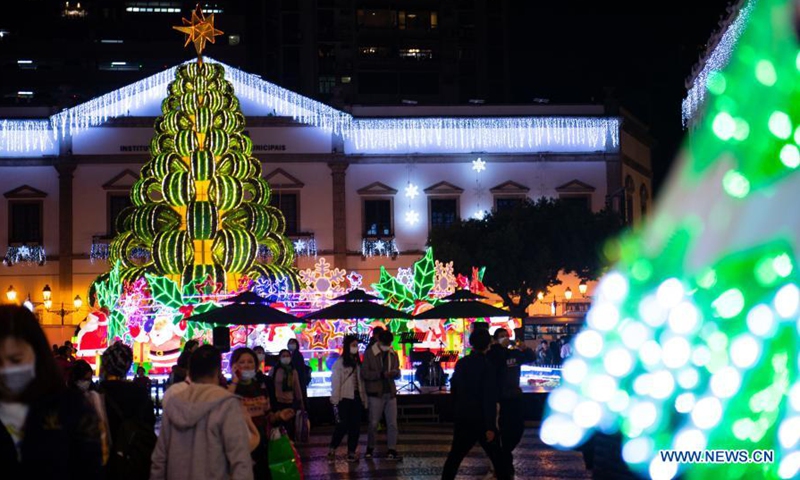 Tourists view the Christmas decorations at the Largo Do Senado in Macao, south China, Dec. 22, 2020. (Xinhua/Cheong Kam Ka)