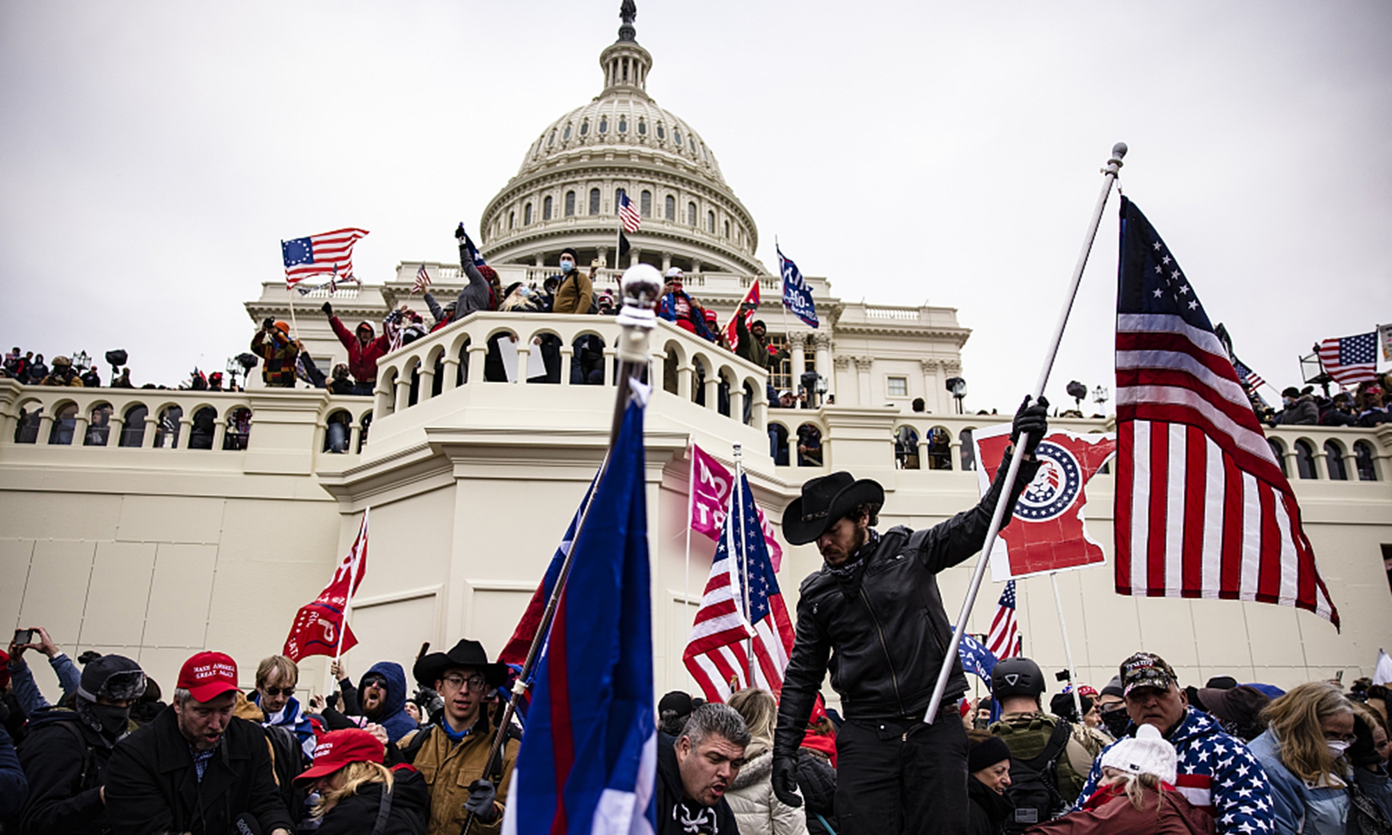 Pro-Trump supporters storm the US Capitol following a rally with President Donald Trump on January 6, 2021 in Washington, DC. Trump supporters gathered in the nation's capital to protest the ratification of President-elect Joe Biden's Electoral College victory over President Trump in the 2020 election. Photo: Samuel Corum/Getty Images/VCG