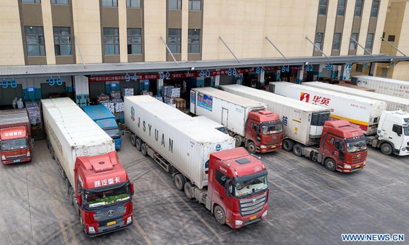 Aerial photo taken on Jan. 7, 2021 shows imported cold chain food discharged at a regional cold chain center in Wuhan, capital of central China's Hubei Province.Photo:Xinhua