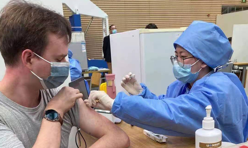 Maxim Shishkov, from Russia, gets COVID-19 vaccinated in Shanghai. Photo: Courtesy of Maxim Shishkov