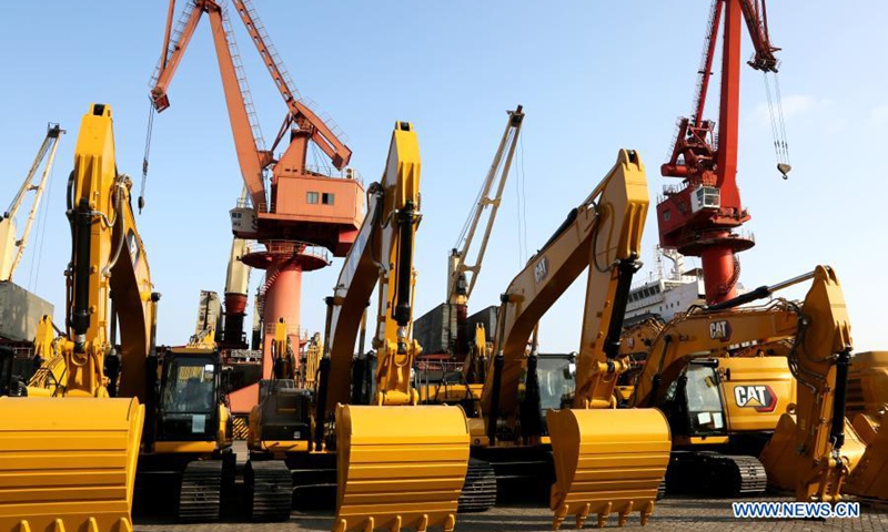 Excavators are seen at a port of a company in Lianyungang, east China's Jiangsu Province, Nov. 16, 2020.