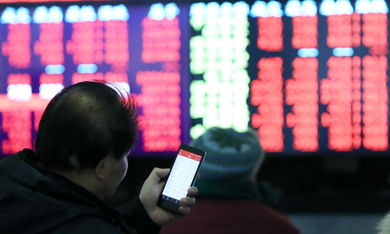 Investors are seen at a stock trading hall in east China's Shanghai, Feb. 25, 2019. (Xinhua/Zhuang Yi)