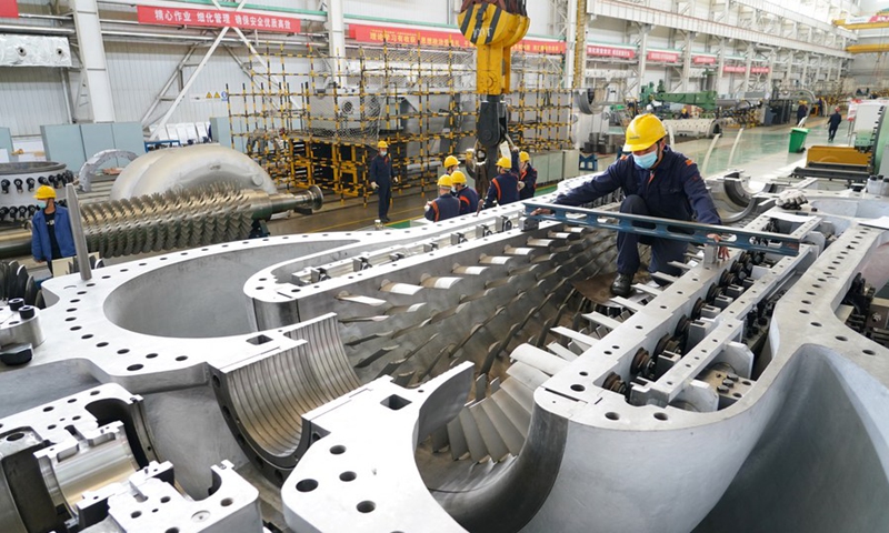 An engineer assembles an axial-flow compressor at a workshop of the Shaanxi Blower (Group) Co., Ltd., a state-owned enterprise, in Xi'an, northwest China's Shaanxi Province, Nov. 18, 2020. (Xinhua/Shao Rui)