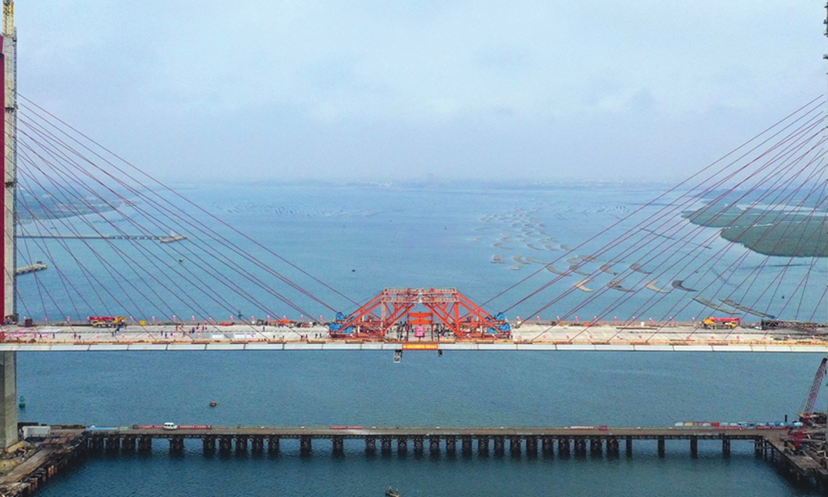 A bridge over the Zhanjiang River, undertaken by the China Railway Major Bridge Engineering Group, is successfully completed on Monday. The 9.36-kilometer bridge is a key project in South China's Guangdong Province, and will strengthen connectivity within the province, as well as the Guangdong-Hong Kong-Macau Greater Bay Area. It will be a key development project to boost local economic growth. 
Photo: Xinhua 
