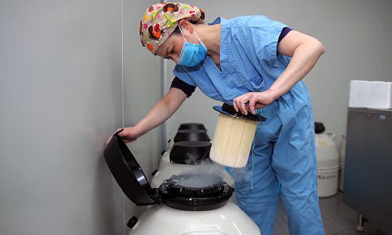 A doctor opens a liquid nitrogen storage container for sperm or eggs at the assisted reproductive medicine center of Sichuan Provincial People's Hospital in the southwestern city of Chengdu. Photo: VCG