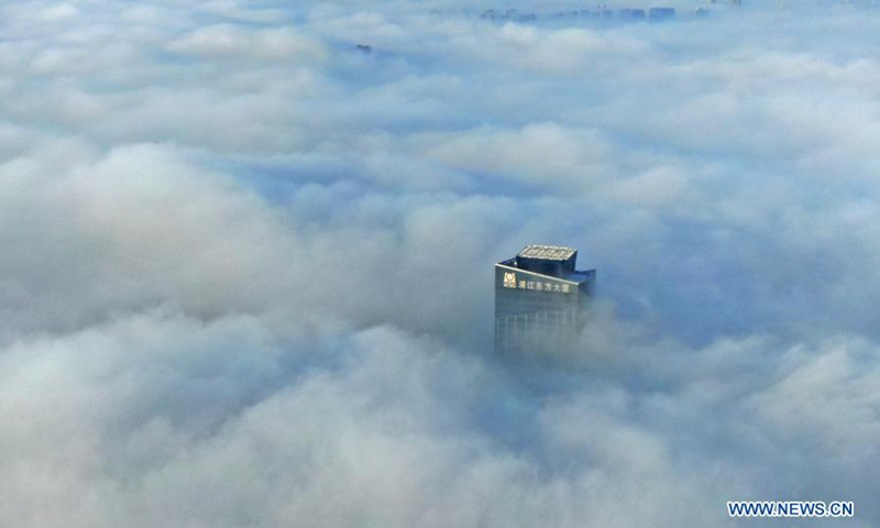 Aerial photo shows a skyscraper shrouded in fog in Hunnan District of Shenyang, northeast China's Liaoning Province on Jan. 26, 2021. (Xinhua/Yang Qing) 