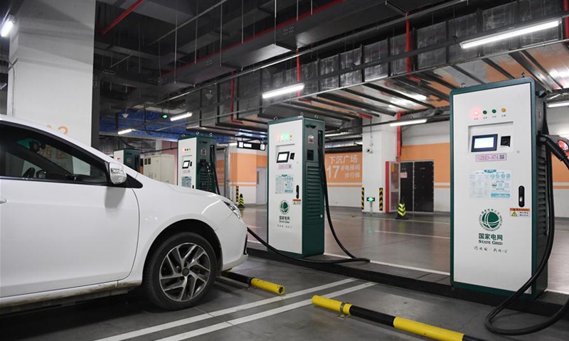An electric vehicle is connected to one of the charging points at a newly-opened electric vehicle charging station in the underground parking lot of the Wukesong sports center in Beijing, capital of China, May 16, 2020. Photo: Xinhua