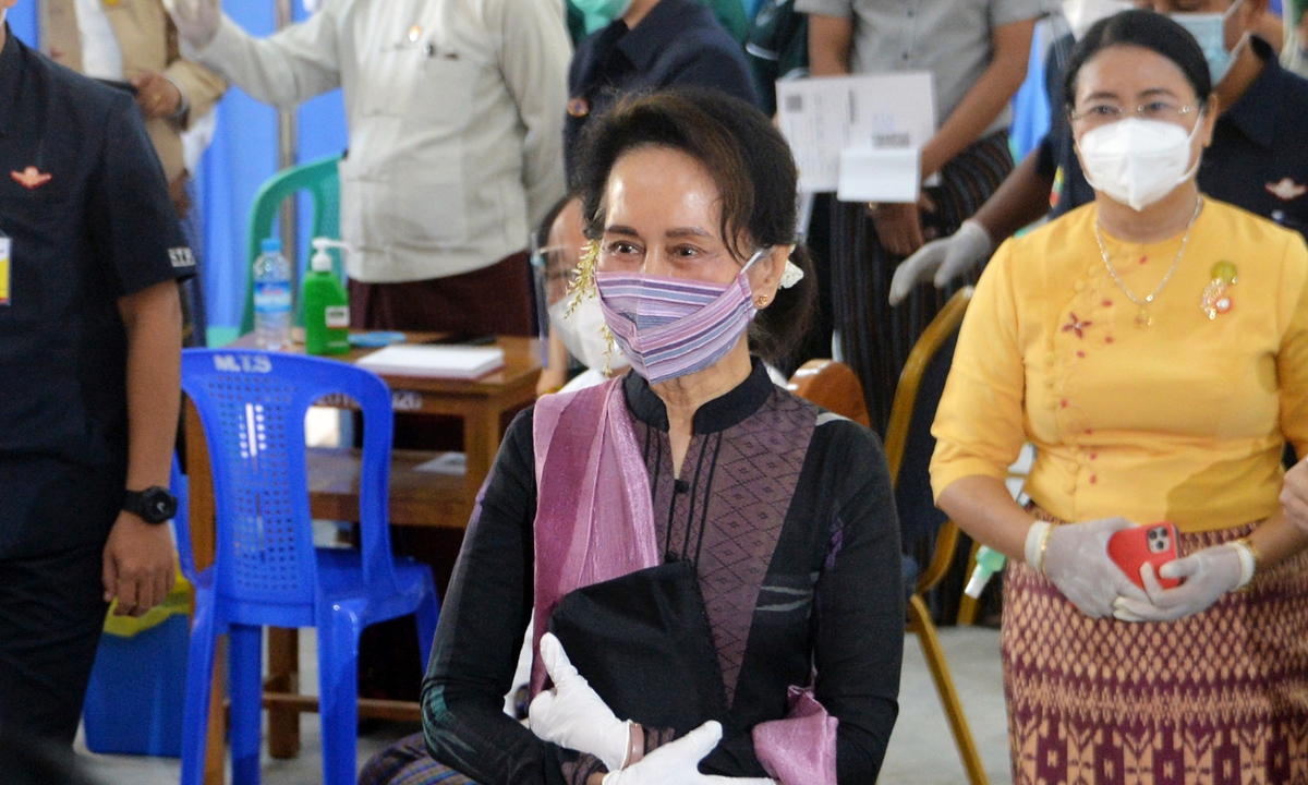 Myanmar's State Counsellor Aung San Suu Kyi looks on as health workers receive a vaccine for COVID-19 at a hospital in Nay Pyi Taw, Myanmar on Wednesday. The country has reported more than 138,000 infections with 3,069 deaths. Photo: AFP