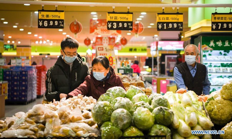 Consumers shop at a supermarket in Xiangfang District, Harbin, northeast China's Heilongjiang Province, Jan. 25, 2021. Heilongjiang authorities have been making continuous efforts to ensure food supply amid the ongoing COVID-19 pandemic. (Xinhua/Wang Song) 