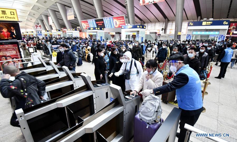 Passengers check in with an orderly manner at Beijing South Railway Station in Beijing, capital of China, Feb. 1, 2021. Beijing South Railway Station carries out a series of COVID-19 prevention and control measures to make sure the safety of passengers during the Spring Festival travel season. (Xinhua/Li Xin) 