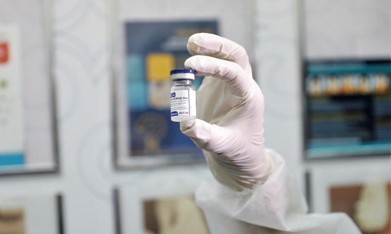 A healthcare worker shows the Sputnik V vaccine at a local hospital in Nur-Sultan, Kazakhstan, on Feb. 1, 2021. Kazakhstan began its coronavirus vaccination campaign Monday using Russian-made Sputnik V. According to the ministry, the vaccination, carried out on a voluntary and free basis, will continue until the end of 2021 and will cover up to 6 million people. (Photo by Kalizhan Ospanov/Xinhua)