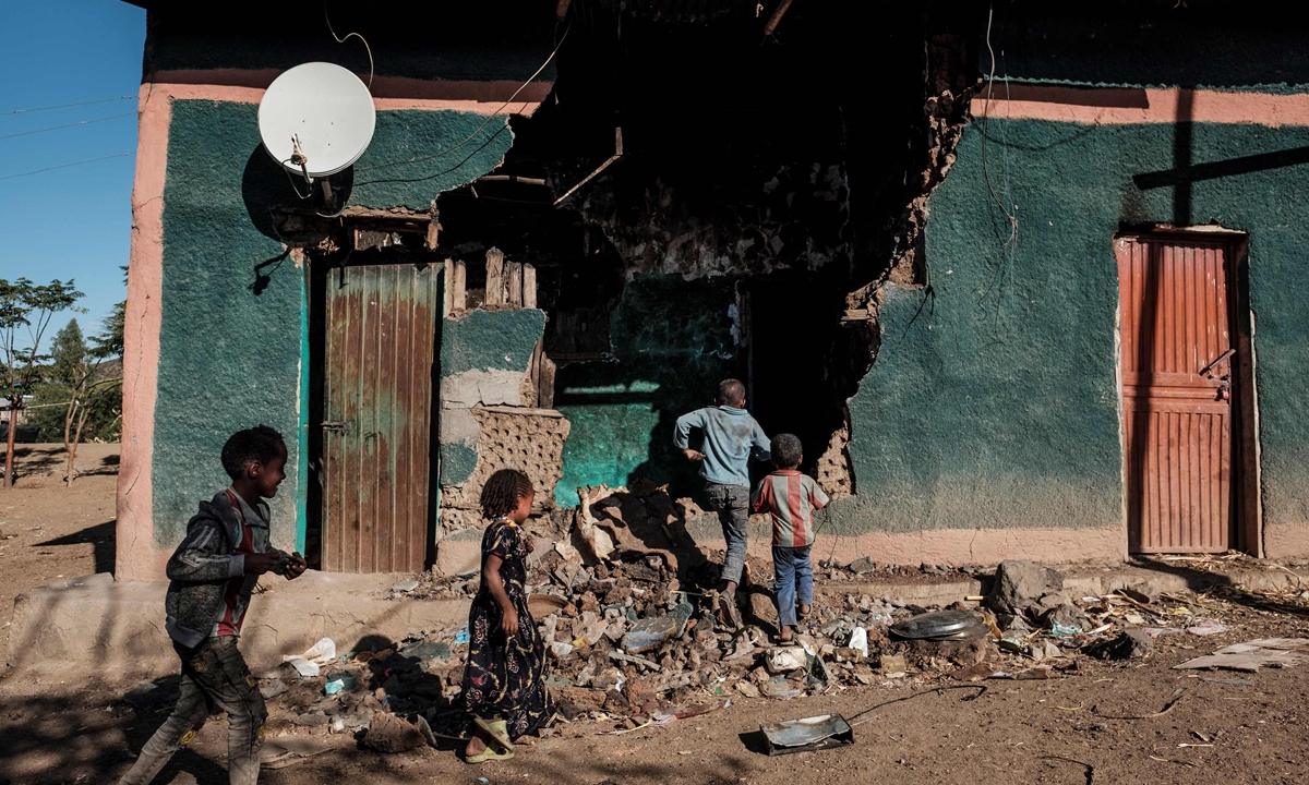 Children playing in front of the house in Bisober Village, Tigray, Ethiopia, December 9, 2020.  Photo: VCG