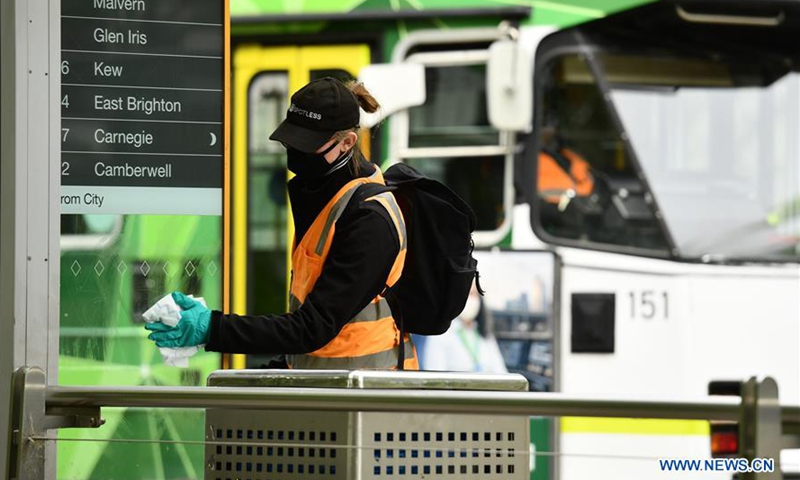 A worker wearing mask cleans the tram station in CBD of Melbourne, Victoria, Australia, on Oct. 19, 2020. After more than three months of lockdown, metropolitan Melbourne moved from second step to third step of restrictions, and regional Victoria continues in third step with further easing of restrictions from midnight of Oct. 27. The whole state recorded zero new COVID-19 infection and virus-related death for a second day in a row on Oct. 27.Photo:Xinhua
