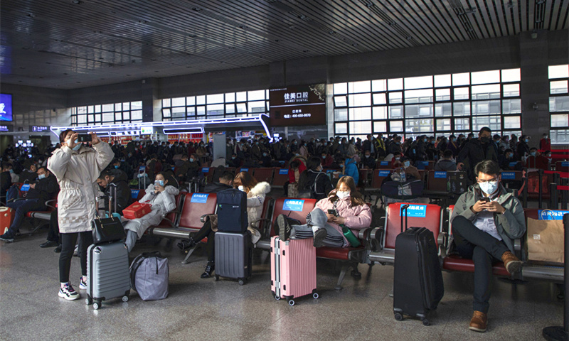 As the Spring Festival, which falls on February 12, approaches, the passenger flow at the Beijing West Railway Station begins to grow. This year's Spring Festival travel rush lasts for 40 days from January 28 to March 8 and 1.15 billion passengers are estimated to travel, down over 20 percent from 2020 and down 60 percent from 2019, per Ministry of Transport. Photo: VCG